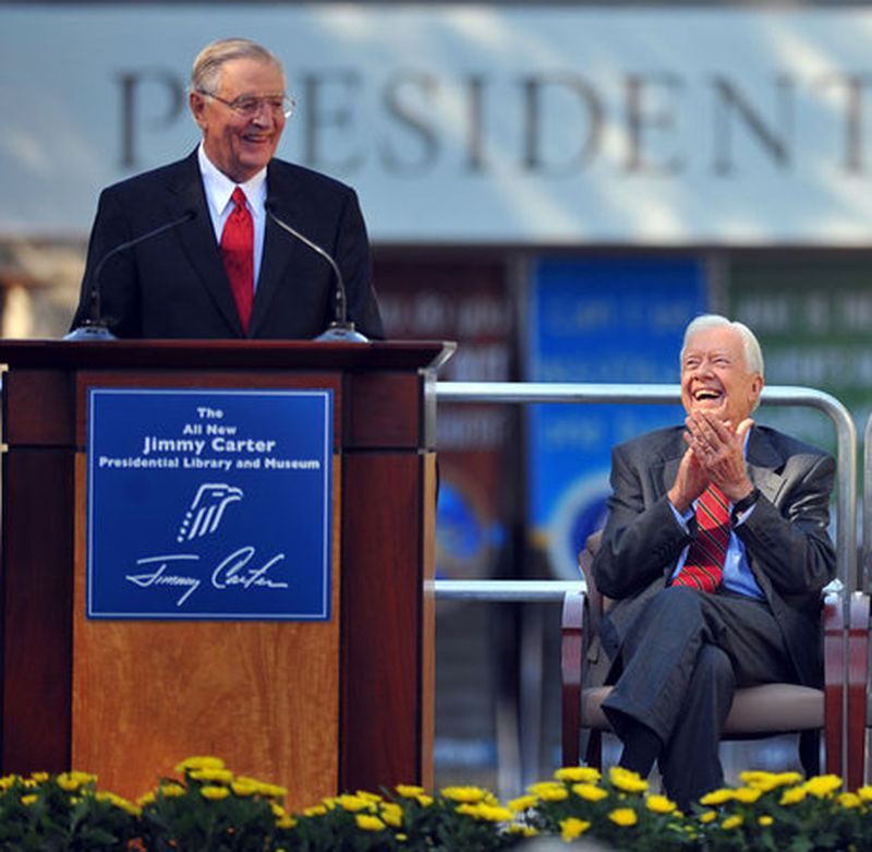 Former president Jimmy Carter laughs at a comment by his former vice president Walter Mondale during his 85th birthday and reopening ceremony of the Carter Presidential Museum. (Brant Sanderlin, AJC)