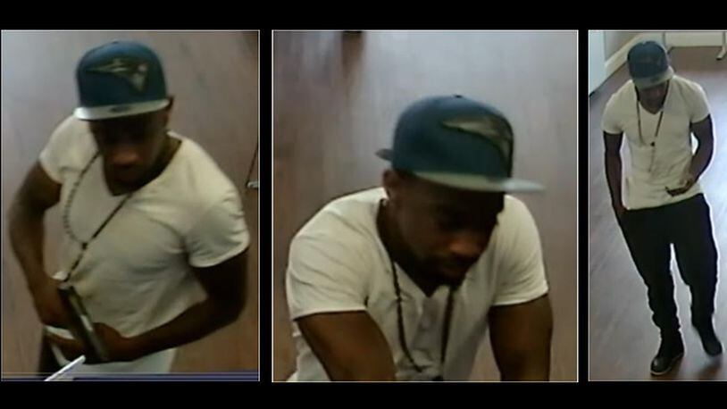 Gwinnett County police are looking for a man suspected of robbing a Metro PCS store at gunpoint.