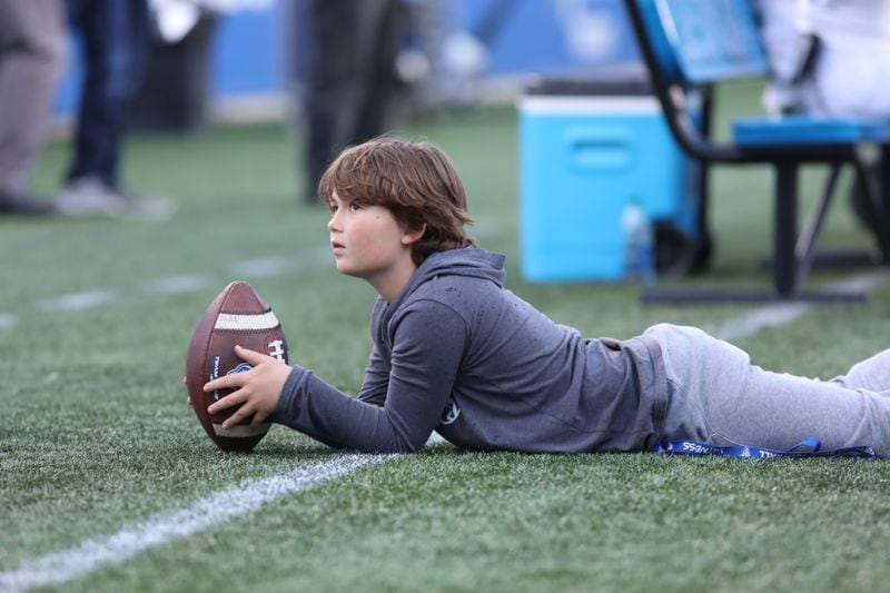 A young boy watches the Georgia State Panthers 2022 spring game from the sidelines on Friday, April, 2022, in Atlanta. Branden Camp/For The Atlanta Journal-Constitution