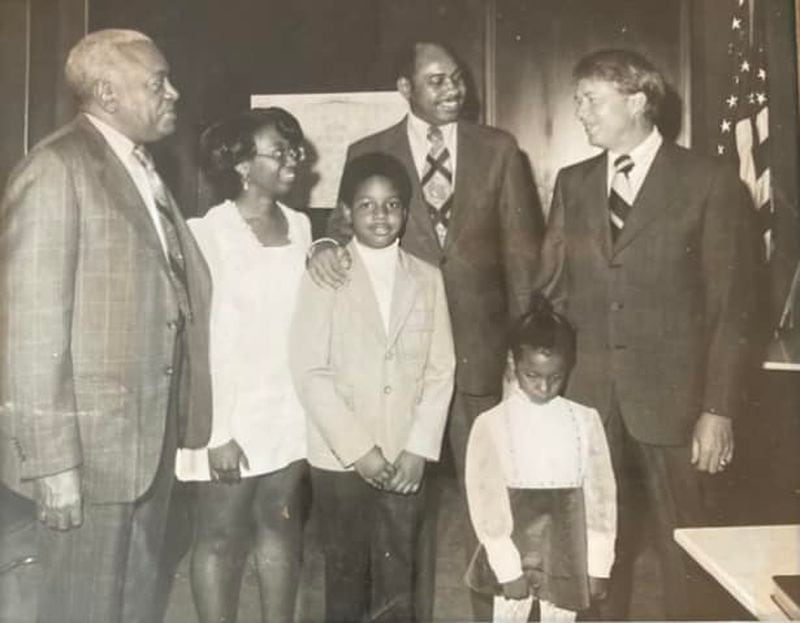 Dr. Otis McCree, Ernesta Blackmon Ingram, Harold Dawson Jr., Harold Dawson Sr., Cari Dawson and Governor Carter. This was around 1972-1973.