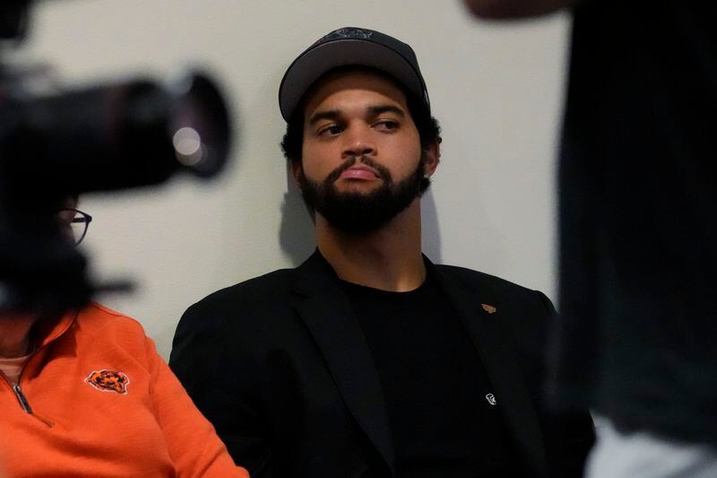 Chicago Bears No. 1 draft pick quarterback Caleb Williams listens to No. 9 draft pick wide receiver Rome Odunze during an NFL football news conference in Lake Forest, Ill., Friday, April 26, 2024. (AP Photo/Nam Y. Huh)