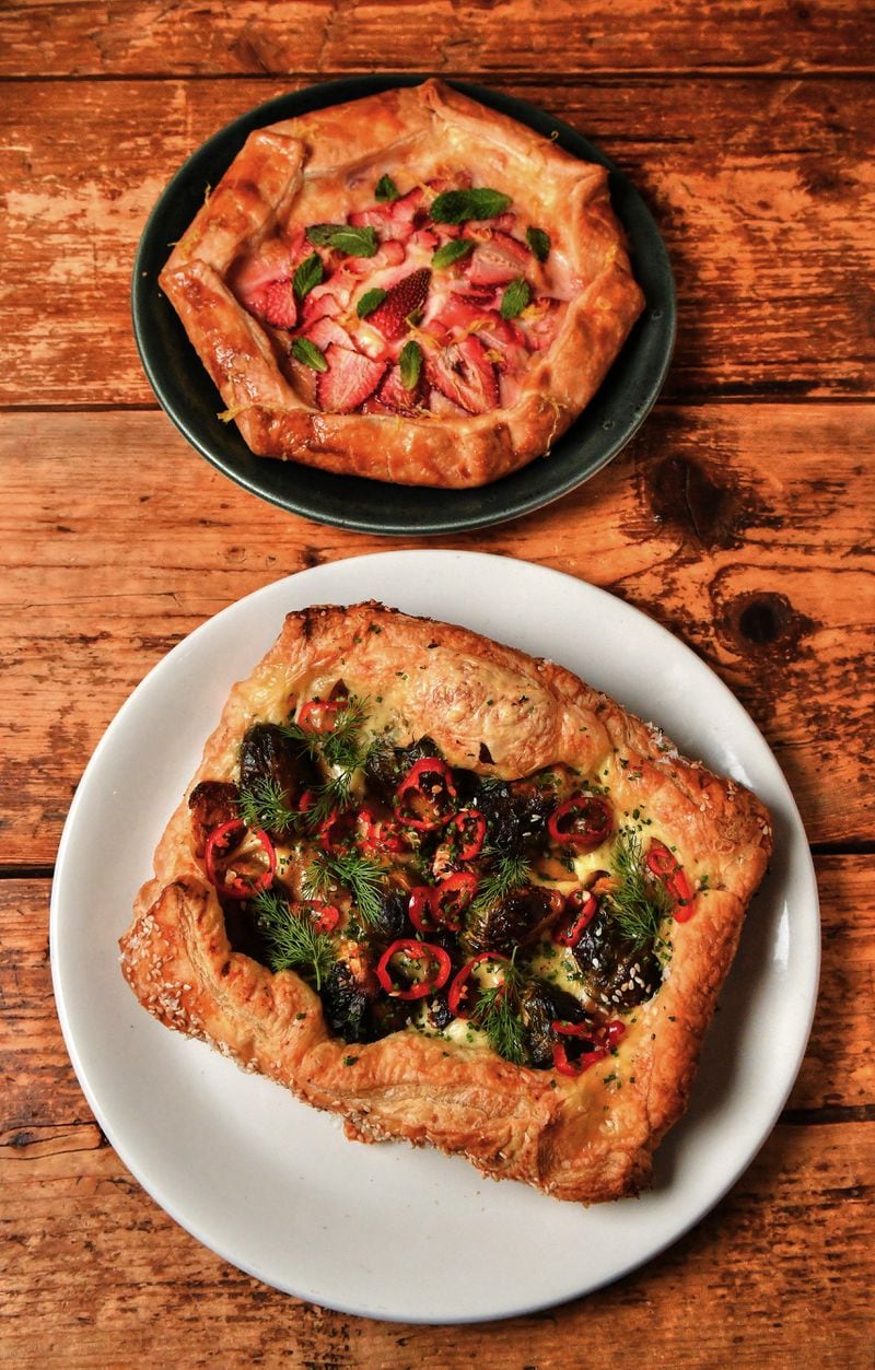 Galettes can be sweet or savory, as shown by these creations from Two Urban Licks executive chef Shain Wancio: a sweet one (top) with strawberries and sweetened cream cheese made with pie crust; and a savory one (bottom) featuring cheese, fingerling potatoes and Brussels sprouts and made with puff pastry. (Styling by chef Shain Wancio / Chris Hunt for the AJC)