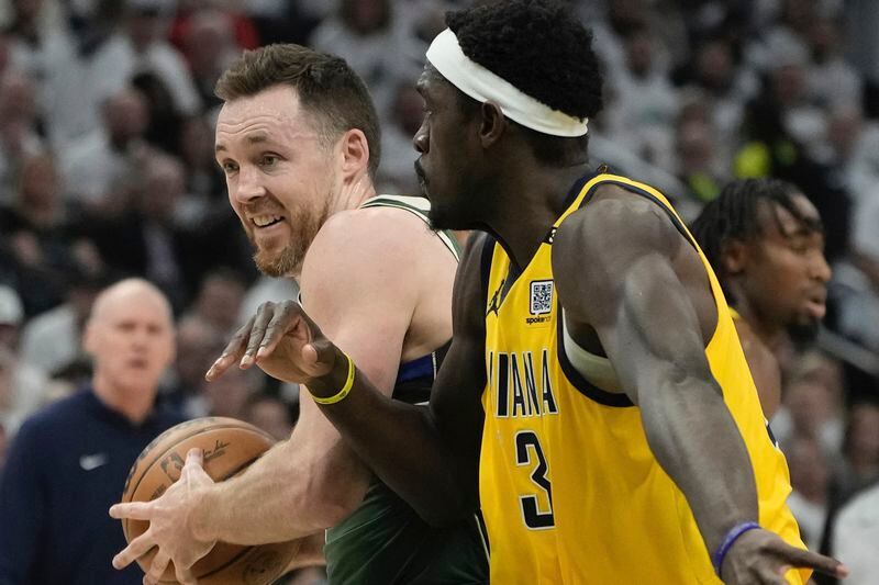 Milwaukee Bucks' Pat Connaughton gets ast Indiana Pacers' Pascal Siakam during the first half of Game 2 of the NBA playoff basketball game Tuesday, April 23, 2024, in Milwaukee. (AP Photo/Morry Gash)