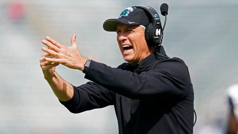 Tulane head coach Willie Fritz calls for a timeout during the first half of an NCAA college football game against Cincinnati in New Orleans, Saturday, Oct. 30, 2021. (AP Photo/Gerald Herbert)