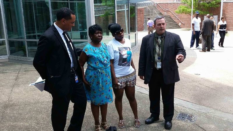 From left to right: Detective David Quinn, Lenora Flanagan, Bottoms’ mother Myeka Jennings and Capt. Paul Guerrucci at the press conference in 2014.
