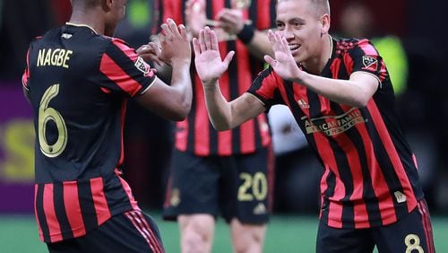 March 17, 2019 Atlanta: Atlanta United midfielder Ezequiel Barco (right) gets five from Darlington Nagbe after heading the ball into the net past Philadelphia Union defender Haris Medunjanin to tie it up 1-1 during the second half in a MLS soccer match that ended in a 1-1 draw on Sunday, March 17, 2019, in Atlanta.   Curtis Compton/ccompton@ajc.com