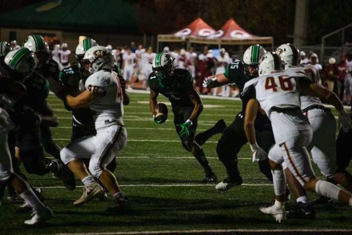 Marquis Willis, senior wide receiver for Roswell, runs the ball during the Mill Creek vs. Roswell high school football game on Friday, November 27, 2020, at Roswell High School in Roswell, Georgia. Roswell defeated Mill Creek 28-27. CHRISTINA MATACOTTA FOR THE ATLANTA JOURNAL-CONSTITUTION