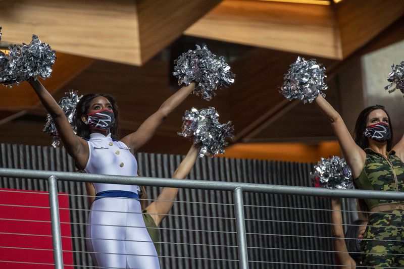 Falcons cheerleaders perform in military-theme uniforms during the game against the Denver Broncos Sunday, Nov. 8, 2020, at Mercedes-Benz Stadium in Atlanta.  (Alyssa Pointer / Alyssa.Pointer@ajc.com)