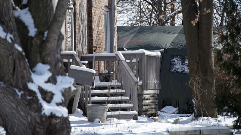 A police forensics tent sits in the backyard of a house on Mallory Crescent in Toronto on Tuesday, Jan. 30, 2018. Police found human remains of at least six people while investigating the case against landscaper and suspected serial killer Bruce McArthur.