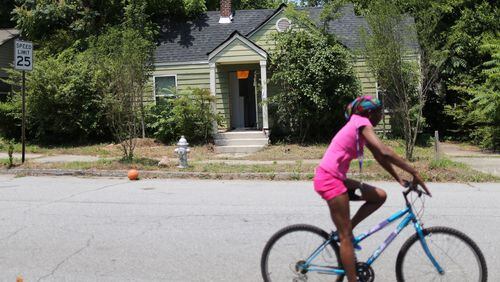 Code enforcement officers have tried for years to find the owner of this Atlanta home, but state corporate disclosure laws make it difficult. Ben Gray / bgray@ajc.com