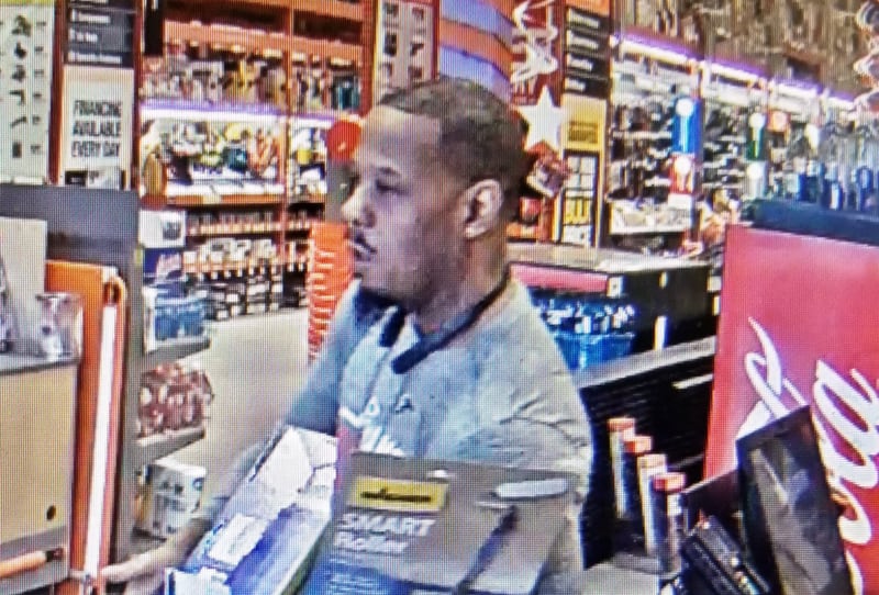 Atlanta police released a surveillance photo of a man using the officer's stolen credit card to purchase items at Home Depot.