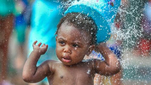 Michael Watts, 16 months, enjoys the Splashpad at Atlanta’s Historic Fourth Ward Park in June. It was the second-hottest summer in the history of Atlanta. The National Weather Service’s records go back to 1887. JOHN SPINK /JSPINK@AJC.COM