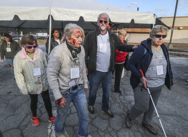 About 50 people volunteered to act as victms  in realistic disaster scenarios and scenes during the emergency preparedness training session Thursday, Oct. 19, 2023. (John Spink / John.Spink@ajc.com) 

