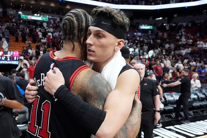 Chicago Bulls guard DeMar DeRozan (11) and Miami Heat guard Tyler Herro congratulate each other after the Heat beat the Bulls 112-91 in an NBA basketball play-in tournament game, Friday, April 19, 2024, in Miami. (AP Photo/Wilfredo Lee)