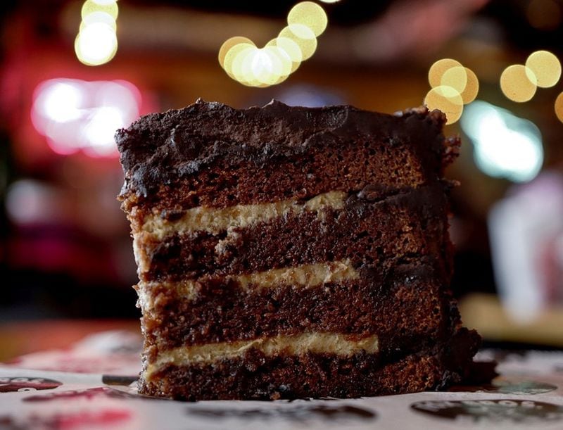 The Dr. Pepper chocolate cake at Fox Bros. Bar-B-Q is three layers of Dr. Pepper-infused cake and butter cream, covered in chocolate ganache. CONTRIBUTED BY JUSTIN FOX