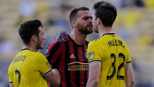 Atlanta United defender Leandro Gonzalez Pirez and Columbus Crew SC forward Patrick Mullins (32) exchange words during the first half in the Round of 16 of the U.S. Open Cup Tuesday, June 18, 2019, at MAPFRE Stadium in Columbus, Ohio.