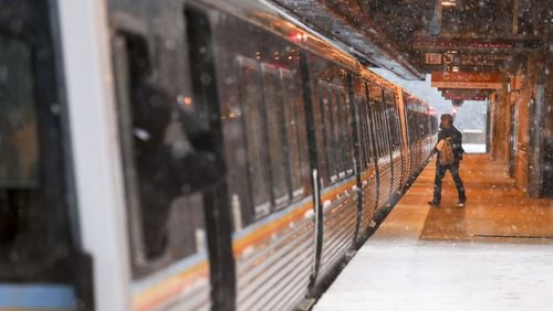 A commuter prepares to board a MARTA train in December ALYSSA POINTER/ALYSSA.POINTER@AJC.COM AJC File Photo