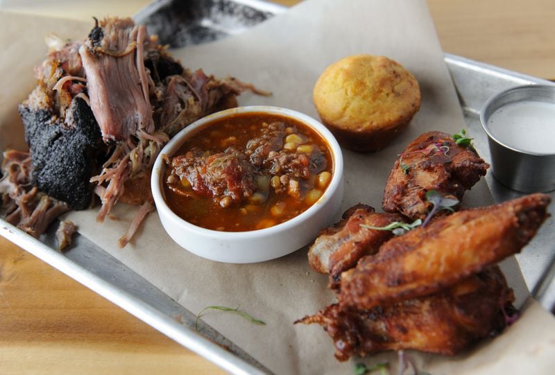 Pulled pork and wings, smoked pork brunswick stew and cornbread at The Smoke Ring in Atlanta's Castleberry Hill neighborhood. (BECKY STEIN)