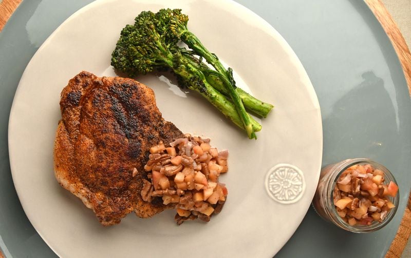 Grilled Pork Chops with Apple and Pecan Relish is a perfect dish for fall. Extra relish can be served with chicken or tempeh, or added to a grilled cheese sandwich. (Styling by Taylor Mead / Chris Hunt for the AJC)