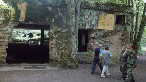 FILE - Tourists visit the ruins of Adolf Hitler's headquarters the "Wolf's Lair" in Gierloz, northeastern Poland, July 17, 2004 where his chief of staff members made an unsuccessful attempt at Hitler's life on July 20, 1944. Polish prosecutors have discontinued an investigation into human skeletons found at Wolf's Lair where German dictator Adolf Hitler and other Nazi leaders spent time during World War II because the advanced state of decay made it impossible to determine the cause of death, a spokesman said Monday, May 6, 2024. (AP Photo/Czarek Sokolowski, File)