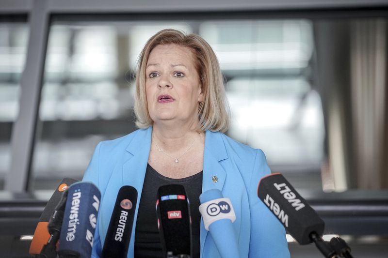 German Minister of the Interior and Home Affairs Nancy Faeser gives a press statement at the start of the meeting of her parliamentary group in the Bundestag in Berlin, Germany, Tuesday April 23, 2024. (Kay Nietfeld/dpa via AP)