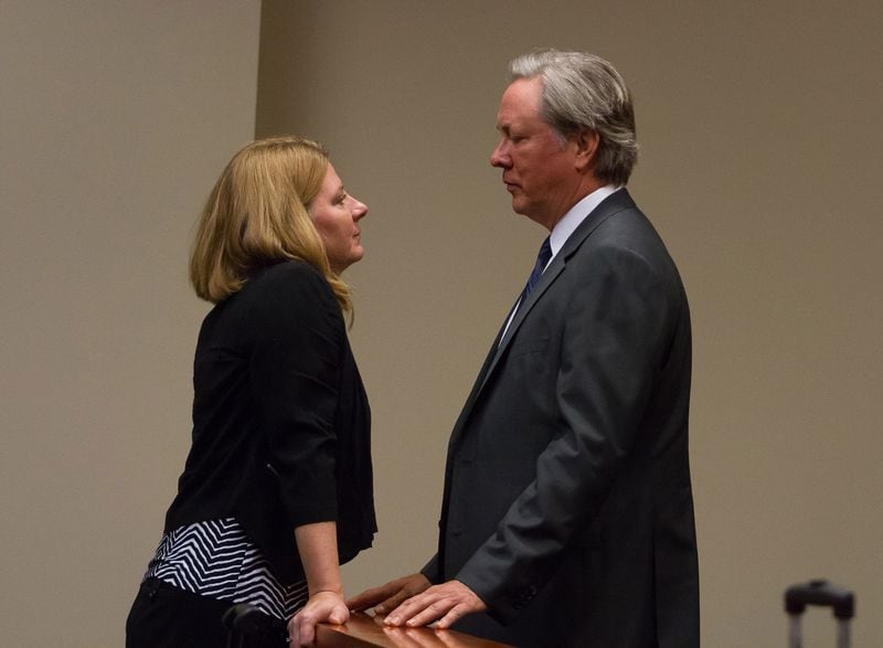 Former DeKalb County Police Officer Robert Olsen talks with his wife, Kathy, during a break of his pretrial immunity hearing at the DeKalb County Superior Court in Decatur GA on Monday, May 21, 2018. STEVE SCHAEFER / SPECIAL TO THE AJC