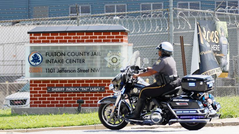 A police motorcycle is seen entering the Fulton County Jail on Thursday, August 16, 2023. The surrender of the 19 individuals indicted by Fulton prosecutors, including former President Donald Trump, is anticipated within the coming days.