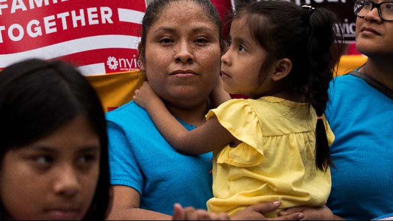 Mexican immigrant Nieves Ojendiz holds her 4-year old daughter Jane as she attends an immigration reform rally with members and supporters of the New York Immigration Coalition, June 28, 2016 in New York City, New York.