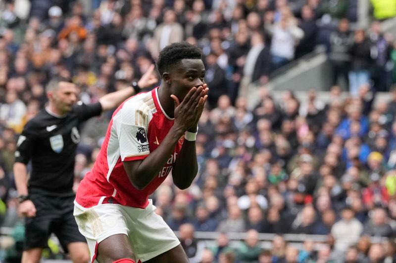 Arsenal's Bukayo Saka reacts after missing an opportunity to score during the English Premier League soccer match between Tottenham Hotspur and Arsenal at the Tottenham Hotspur Stadium in London, England, Sunday, April 28, 2024. (AP Photo/Kin Cheung)