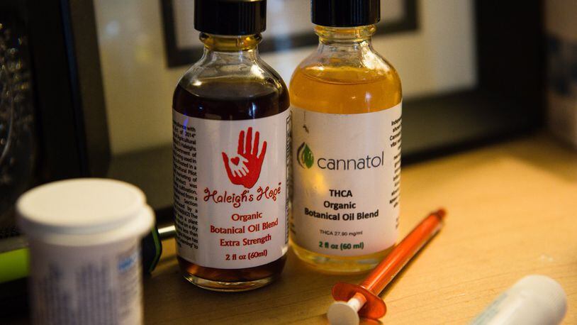 Bottles of medical marijuana that Janea Cox uses to treat her daughter Haleigh, 7, at their home in Forsyth, Ga., on Feb. 17, 2017. Haleigh suffers from Lennox Gastaux Syndrome, a form of severe epilepsy. Georgia’s medical marijuana law, authored by State Rep. Allen Peake, bears her name. Haleigh’s Hope Act legalizes the possession of cannabis oil for people suffering from a limited number of illnesses, but does not allow for in-state cultivation. The Coxes must still travel to Colorado to obtain the medical marijuana used to treat Haleigh. BITA HONARVAR/SPECIAL