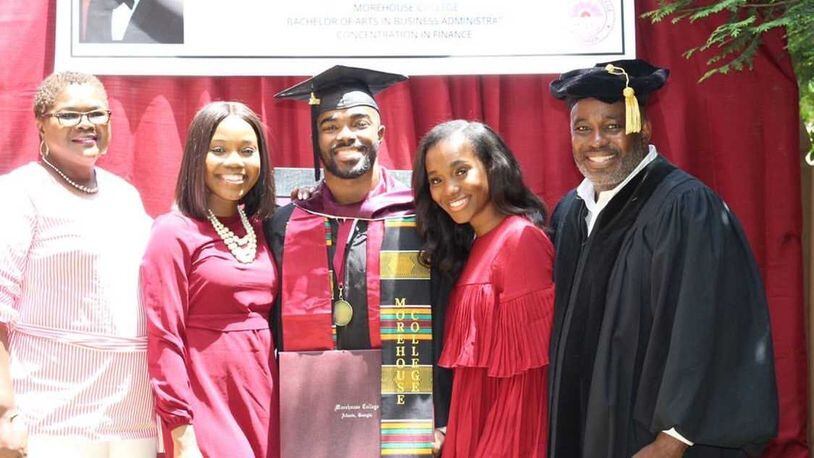 Terrell Jones Jr. (center) poses for a picture alongside his sisters, Alexis and Amber, and parents, Terrell Jones Sr. and Frances, after the family surprised him with a commencement ceremony in their backyard to celebrate his graduation from Morehouse College.