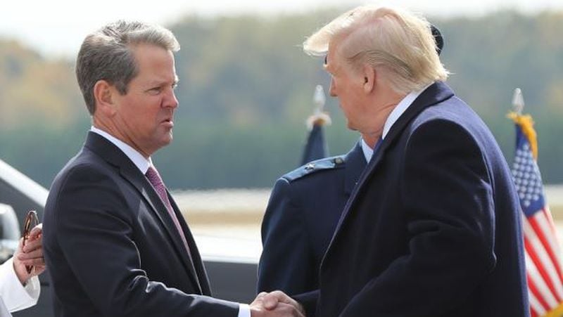 Georgia Governor Brian Kemp greets President Donald Trump as he arrives at Dobbins AFB on Friday, November 8, 2019, in Marietta.   Curtis Compton/ccompton@ajc.com