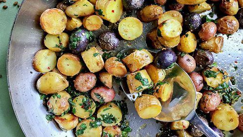 Fingerling potato salad topped with basil and made in a skillet. (Gretchen McKay/Pittsburgh Post-Gazette/TNS)