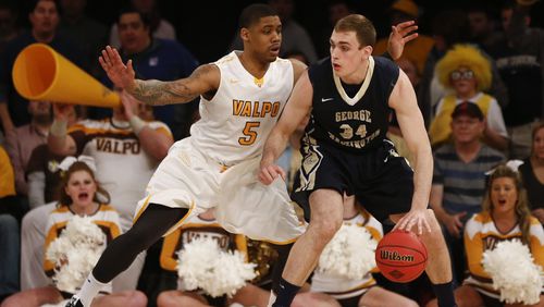 Darien Walker of the Valparaiso Crusaders guards Tyler Cavanaugh of the George Washington Colonials during their NIT Championship game at Madison Square Garden on March 31, 2016 in New York City. (Photo by Jeff Zelevansky/Getty Images)