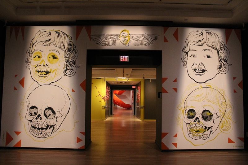 "Macabre by Design" by Egyptian artist Ganzeer (foreground) with work by Atlanta artist Amie Esslinger "Before the Hit" in the background.
Courtesy of the artists