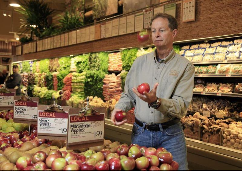Whole Foods CEO John Mackey, shown in a 2009 file photo, will continue to lead the grocer following its acquisition by Amazon.