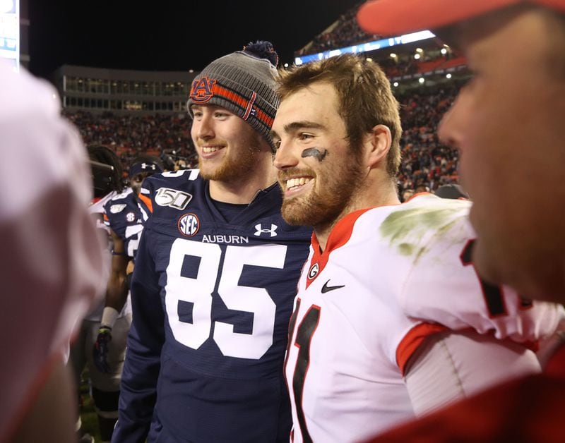 Georgia Bulldogs quarterback Jake Fromm (11) with his brother, Auburn Tigers tight end Tyler Fromm (85).  Bob Andres / robert.andres@ajc.com