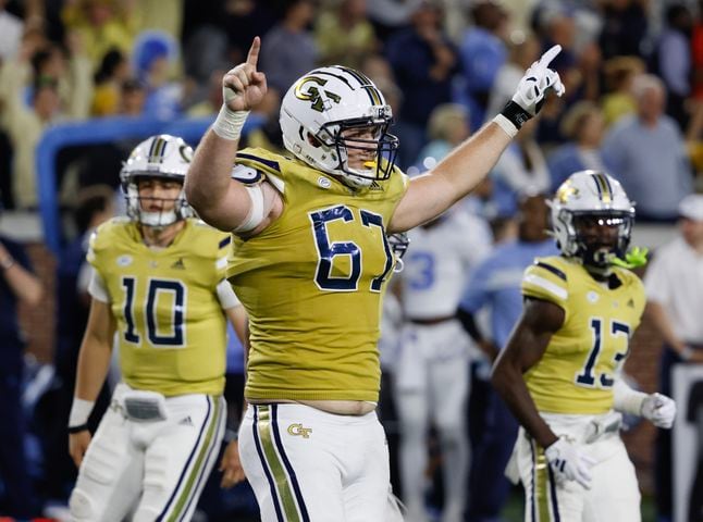 Georgia Tech Yellow Jackets offensive lineman Joe Fusile (67) celebrates the go-ahead touchdown during the fourth quarter.  (Bob Andres for the Atlanta Journal Constitution)