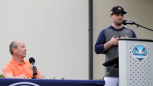 Houston Astros' Alex Bregman (right) delivers a statement regarding the 2017 sign-stealing scheme as Astros owner Jim Crane listens during a news conference before the start of the first official spring training baseball practice for the team Thursday, Feb. 13, 2020, in West Palm Beach, Fla.