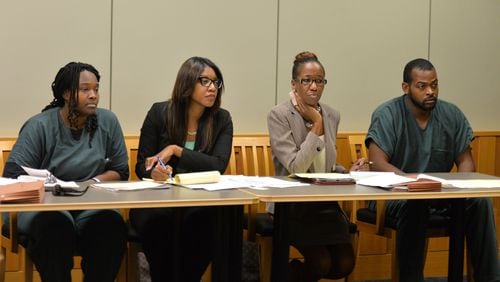 July 10, 2014 Lawrenceville - Recardo (right) and Therian Wimbushat (left) sit with their defense attorneys Otanya Clarke (second from left) and Teri Thompson during a hearing before Gwinnett chief magistrate Christina Blum at Gwinnett Magistrate Court in Lawrenceville on Thursday, July 10, 2014. Bond has been denied for Recardo and Therian Wimbush being held on child cruelty charges that they kept their oldest child a prisoner in their home. HYOSUB SHIN / HSHIN@AJC.COM