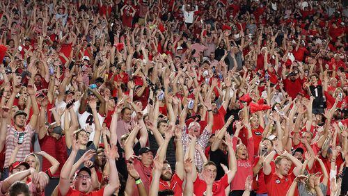 Georgia fans get the wave going during a 40-13 victory over South Carolina in a NCAA college football game on Saturday, Sept 18, 2021, in Athens.  Curtis Compton / Curtis.Compton@ajc.com