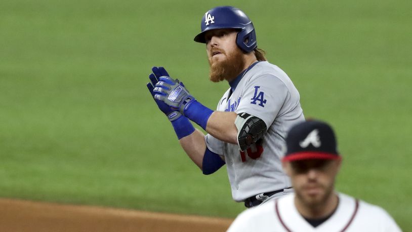Los Angeles Dodgers third baseman Justin Turner (10) reacts to his double in the first inning of Game 5 of the National League Championship Series Friday, Oct. 16, 2020, at Globe Life Field in Arlington, Texas..  (Curtis Compton / Curtis.Compton@ajc.com)