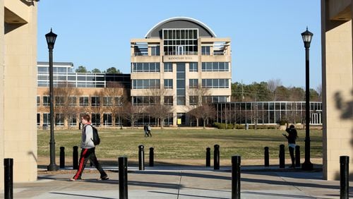 January 30, 2015 - Kennesaw, Ga: Kennesaw State University students walk on the KSU campus as Kennesaw Hall is shown in the background Friday afternoon, January 30, 2015, in Kennesaw, Ga.. PHOTO / JASON GETZ