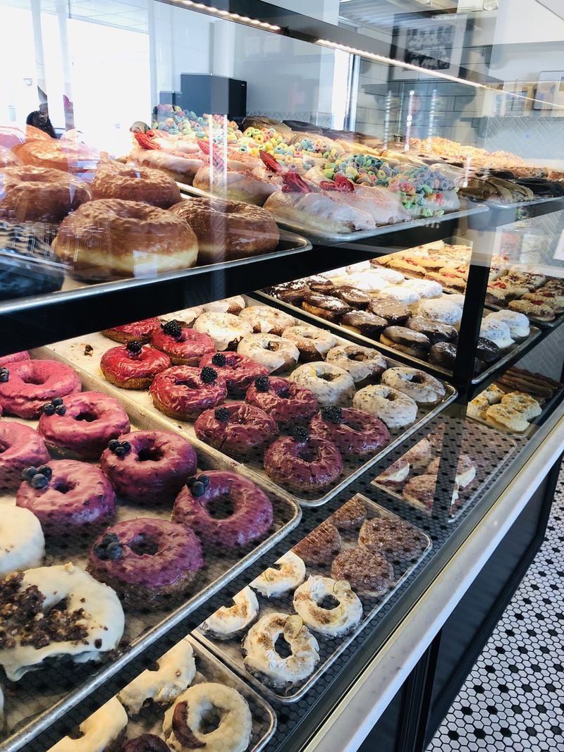 Every day, the display cases at Doughnut Dollies feature more than two dozen varieties of doughnuts. CONTRIBUTED BY DOUGHNUT DOLLIES