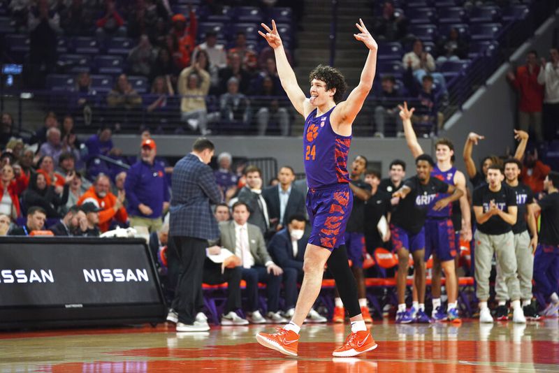 Clemson center PJ Hall celebrates a three pointer by a teammate during the first half of an NCAA college basketball game against Georgia Tech Tuesday, Jan. 24, 2023, in Clemson, S.C. (AP Photo/Sean Rayford)