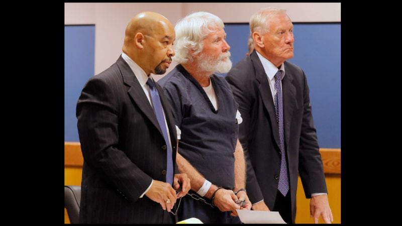 Claud "Tex" McIver stands with his attorneys, William Hill (left) and Steve Maples in this August file photo. Both attorneys have withdrawn from the case.
