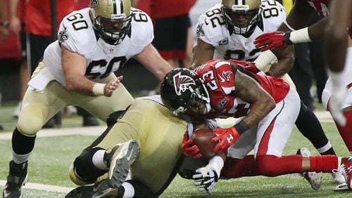 Falcons cornerback Robert Alford recovers a fumble by Saints running back Travaris Cadet at the one yard line during the fourth quarter in a January home game. Curtis Compton / ccompton@ajc.com Falcons cornerback Robert Alford recovers a fumble by Saints running back Travaris Cadet at the one yard line during the fourth quarter in a January home game. Curtis Compton / ccompton@ajc.com