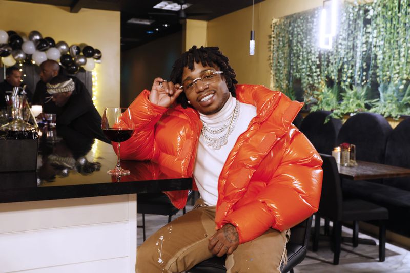R&B singer Jacquees poses for a photograph at The Wine and Papas Lounge, which he co-owns with Voneka Marks. The restaurant opened its doors a month ago and is located in Stonecrest. Miguel Martinez / miguel.martinezjimenez@ajc.com