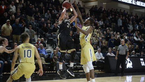 Wofford guard Fletcher Magee shoots over Georgia Tech guard Curtis Haywood late in the Terriers' 63-60 win over the Yellow Jackets Wednesday night in Spartanburg, S.C.