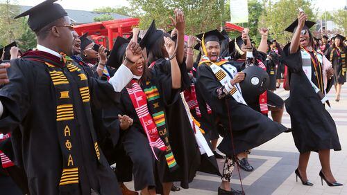 Clark Atlanta University class of 2016 graduates celebrate as they line up for the processional before its Commencement Service. The average student loan debt for students who graduated in 2015 was nearly $41,000, according to a report released Tuesday. BOB ANDRES / BANDRES@AJC.COM